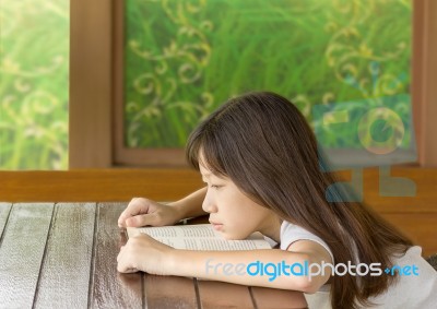 Asian Gir Tired On Desk While Learning Stock Photo