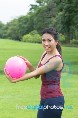 Asian Girl And Pink Ball Stock Photo