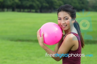 Asian Girl And Pink Ball Stock Photo