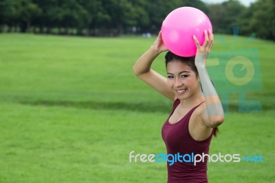 Asian Girl And Pink Ball Stock Photo