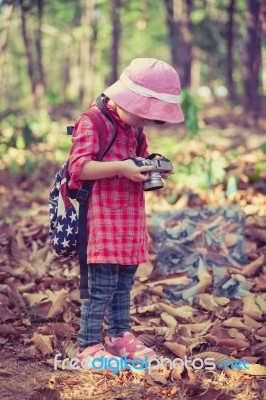 Asian Girl Checking Photos In Digital Camera. Vintage Effect Tone Stock Photo