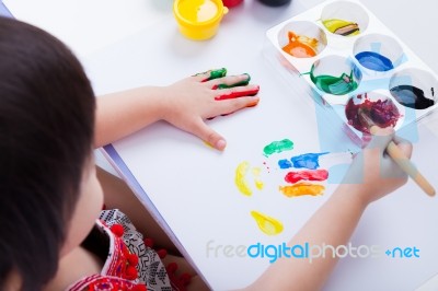 Asian Girl Doing Fingerprints Using Drawing Tools, Art Education… Stock Photo