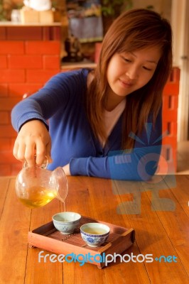 Asian Girl Drinking Tea In Morning Stock Photo