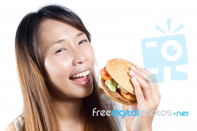 Asian Girl Eating Burger Stock Photo