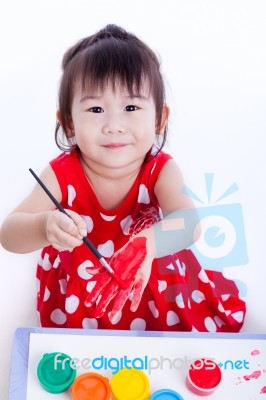 Asian Girl Painting Her Hand Using Drawing Instruments, Creativity And Education Stock Photo