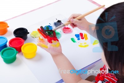 Asian Girl Painting Her Palm Using Drawing Tools, Art Education Stock Photo