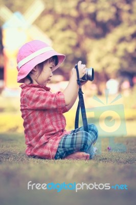 Asian Girl Taking Photos Using Vintage Film Camera In Garden. Vi… Stock Photo