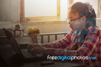 Asian Girl With A Notebook On Table Stock Photo