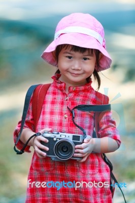 Asian Girl With Digital Camera In Beautiful Outdoor Stock Photo