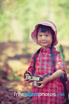 Asian Girl With Digital Camera In Beautiful Outdoor. Vintage Pic… Stock Photo