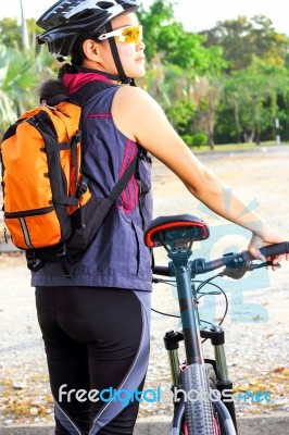 Asian Girl With Mountain Bike Stock Photo