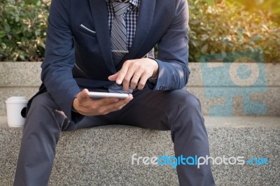 Asian Indian Businessman Using Tablet Pc Outdoors, Golden Sunlig… Stock Photo