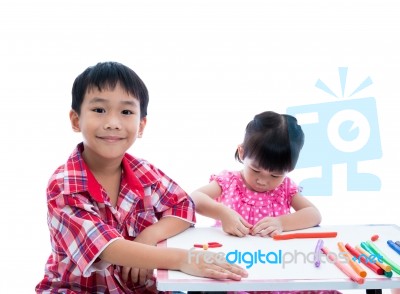 Asian Kids Playing With Play Clay On Table. Strengthen The Imagi… Stock Photo