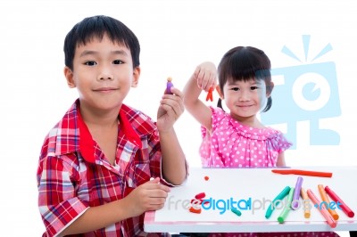 Asian Kids Playing With Play Clay On Table. Strengthen The Imagi… Stock Photo