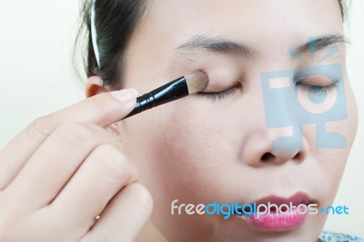 Asian Lady Doing Makeup Stock Photo