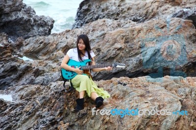 Asian Lady With Guitar Stock Photo