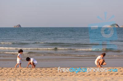 Asian Mom And Son On Beach Stock Photo