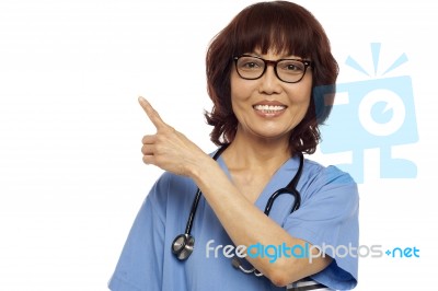 Asian Surgeon Pointing Up Gesture Stock Photo