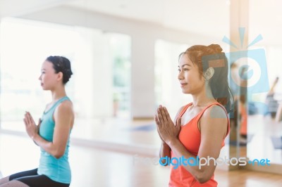 Asian Woman Doing Yoga Indoors Stock Photo