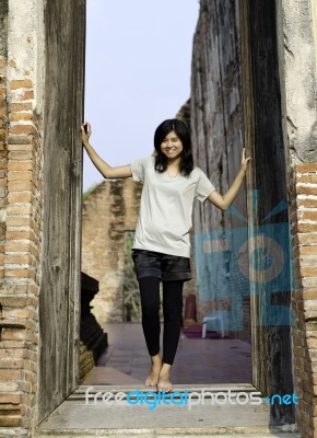 Asian Woman Enjoying At Buddhist Temple In Thailand Stock Photo