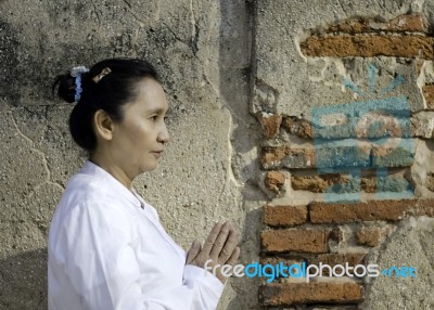 Asian Woman Greets In Temple, Sawasdee Stock Photo