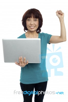 Asian Woman Holding Laptop Stock Photo