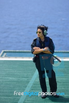 Asian Woman Offshore Helicopter Pilot Is On Offshore Oil Rig Stock Photo