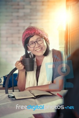 Asian Woman Toothy Smiling Face With Happiness Emotion Discussion In Cofee Shop ,relaxing Emotion ,modern Lifestyle Of People Stock Photo