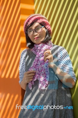 Asian Woman Wearing Wool Hood And Silk Scarf In Winter Season Standing Under Shadow And Light From Open Home Roof Use For Woman And Effect Of Sun Light,and Beauty Issue Related Stock Photo