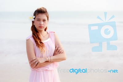 Asian Woman With Plumeria Stock Photo