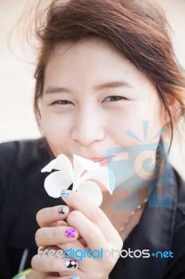 Asian Women Black Shirt. Holding White Flower Stock Photo