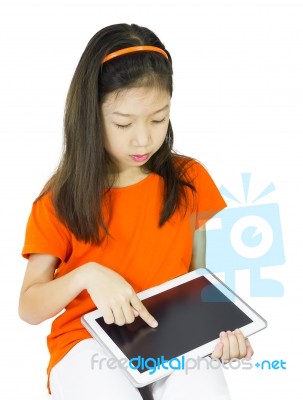 Asian Young Girl Is Holding Tablet Stock Photo