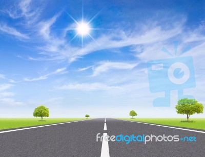 Asphalt Road Leading To Horizon Stock Photo