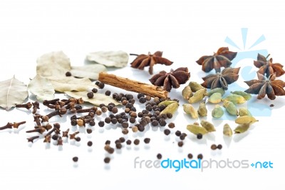 Assorted Exotic Spices On White Background Stock Photo