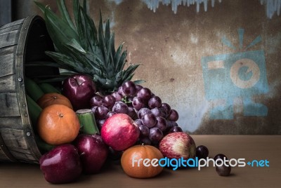 Assorted Fresh Fruits On A Wooden Stock Photo