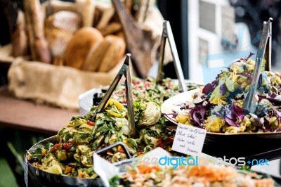 Assorted Fresh Salads Displayed On A Buffet Stock Photo