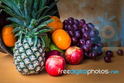 Assorted Fruits Placed On A Wooden Stock Photo