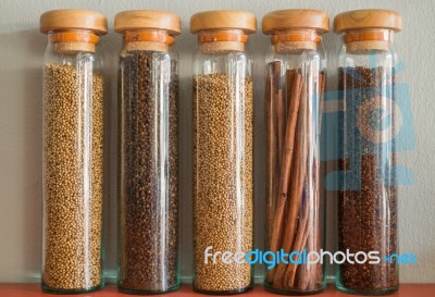 Assortment Of Spices In Glass Bottles Stock Photo