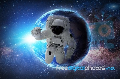 Astronaut In Galaxy. Elements Of This Image Furnished By Nasa Stock Photo