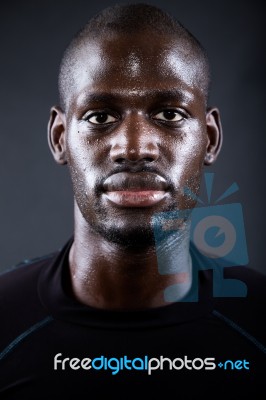 Athletic Man Running In Black Background Stock Photo