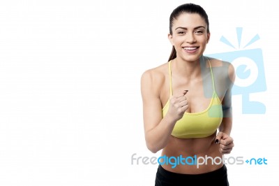 Athletic Woman Running In Sports Outfit Stock Photo