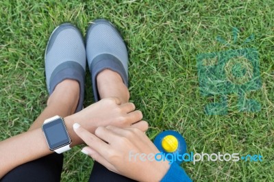 Athletic Woman Using Smartwatch On Top View Stock Photo