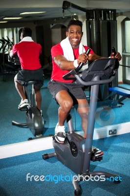 Athletic Young Man At The Gym Stock Photo