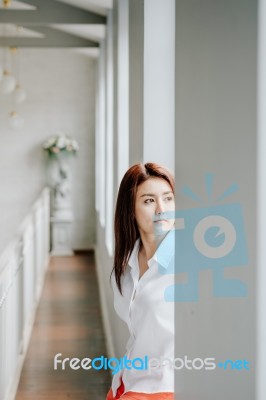 Attractive Asian Girl Portrait With Window Light Stock Photo