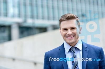 Attractive Businessman Standing At Outdoors Stock Photo