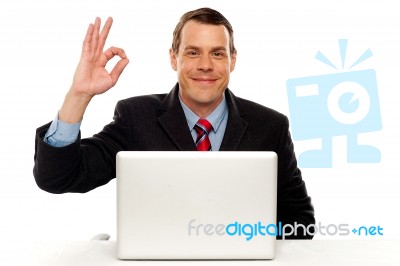 Attractive Businessperson Showing Okay Gesture Stock Photo