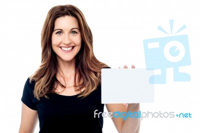 Attractive Businesswoman Holding A Blank Card Stock Photo