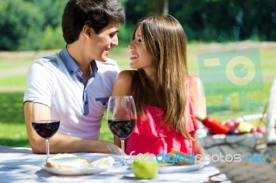 Attractive Couple On Romantic Picnic In Countryside Stock Photo