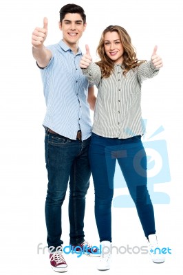 Attractive Couple Showing Thumbs Up Stock Photo