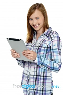 Attractive Cute Girl Holding A Tablet Device Stock Photo